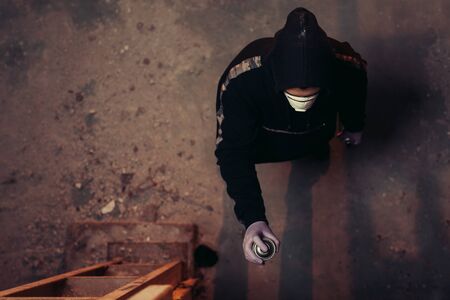 Urban painter starting to draw graffiti on the wall.の写真素材