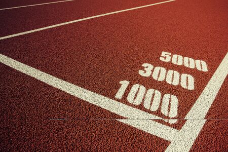 1000m, 3000m, and 5000m tagging on athletic track.の写真素材