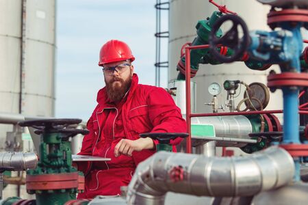 Oil and Gas Industry Worker. Engineer working on pipeline equipment for oil and gas company.