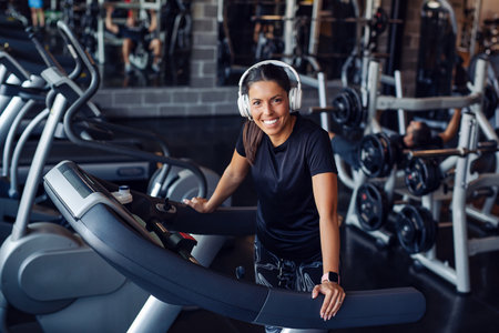 Close up image of attractive fit woman in gym.