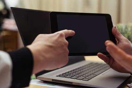 Young woman works on digital tabletの写真素材