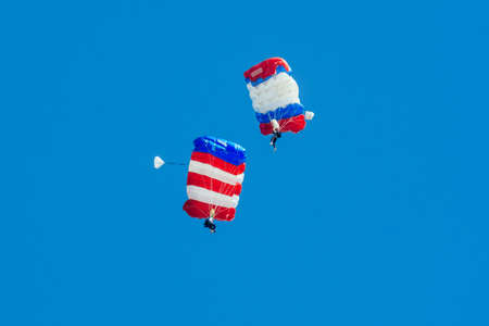 Parachute in the sky. Skydiver is flying a parachute in the blue sky.の写真素材