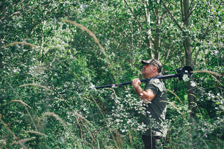 Wildlife photographer outdoor. Professional photographer in nature.の写真素材