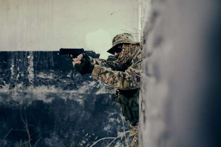 Airsoft solder on battlefield. Airsoft soldier with a rifle.の写真素材