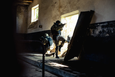 Airsoft soldier with a rifle playing strike-ball.