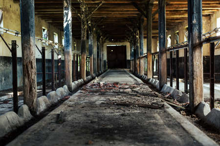 Abandoned pig farm with danger of collapse.