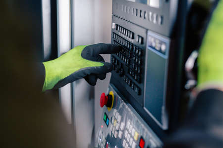 Quality control manufacturing.Hands of an engineer measures a metal part with a digital vernier...
