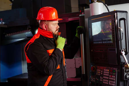 Quality control manufacturing.Hands of an engineer measures a metal part with a digital vernier...