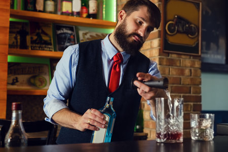 Bartender serve cocktail drink for customer at the barの写真素材