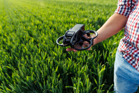 Farmer using modern drone technologies in agriculture and smart farmingの写真素材