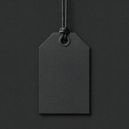 Empty black price tag with string providing copy spaceの素材