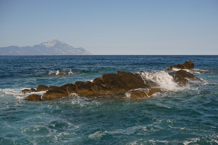 Big rock in the sea with wavesの写真素材
