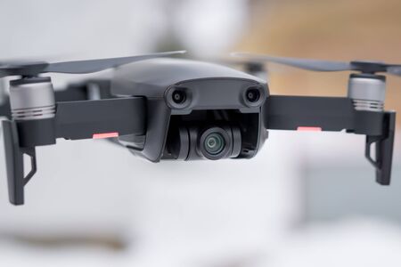 Pancevo - Serbia 03.01.2018. DJI Mavic Air drone flying mid air on cloudy day with snow in background. Smallest foldable drone  with 4K capability.のeditorial素材