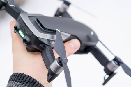 Pancevo - Serbia 03.01.2018. DJI Mavic Air drone in hand on snowy day. Smallest foldable drone with 4K capability.のeditorial素材