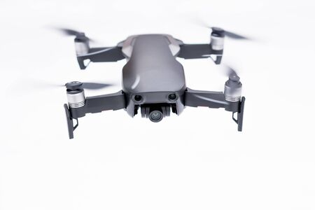 Pancevo - Serbia 03.01.2018. DJI Mavic Air drone flying mid air isolated on white bacground. Smallest foldable drone  with 4K capability.のeditorial素材