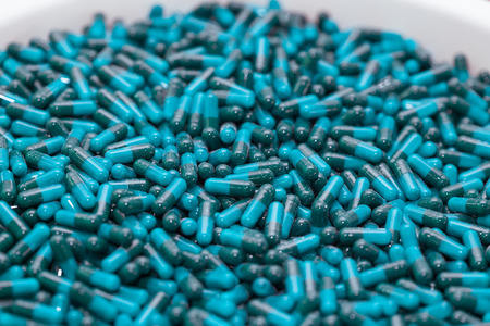 Huge amount of blue capsules, close up.の写真素材