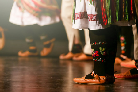 Young Serbian dancers in traditional costume. Folklore of Serbia.