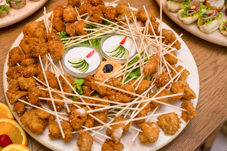 Delicious snacks of food arranged on a plate.の写真素材