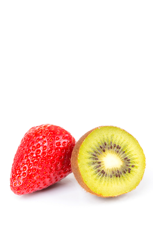 Red fresh strawberries and green kiwi cut into half arranged on a white background.の写真素材
