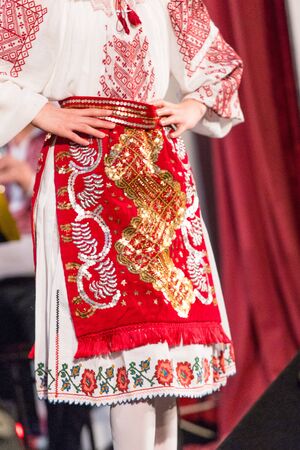 Detail of traditional folkloric costume of Romanian dancers perform a folk dance. Folklore of Romaniaの写真素材