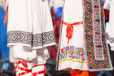 Detail of traditional folkloric costume of Romanian dancers perform a folk dance. Folklore of Romaniaの写真素材