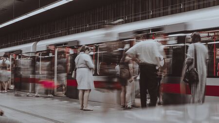 Prague, Czech Republic,23 July 2019; People at metro station entering subway train, long exposure technique for movement. Urban scene, city life, public transport and traffic concept.のeditorial素材