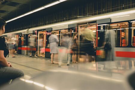 Prague, Czech Republic,23 July 2019; People at metro station entering subway train, long exposure technique for movement. Urban scene, city life, public transport and traffic concept.のeditorial素材