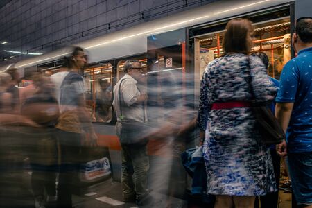 Prague, Czech Republic,23 July 2019; People at metro station entering subway train, long exposure technique for movement. Urban scene, city life, public transport and traffic concept.のeditorial素材