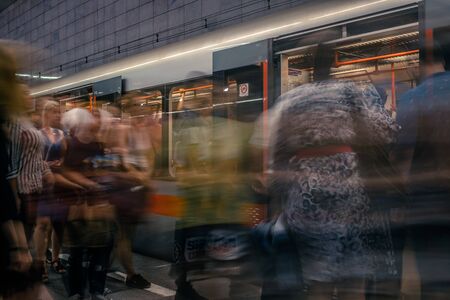 Prague, Czech Republic,23 July 2019; People at metro station entering subway train, long exposure technique for movement. Urban scene, city life, public transport and traffic concept.のeditorial素材