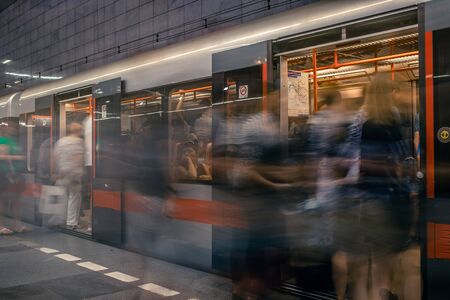 Prague, Czech Republic,23 July 2019; People at metro station entering subway train, long exposure technique for movement. Urban scene, city life, public transport and traffic concept.のeditorial素材