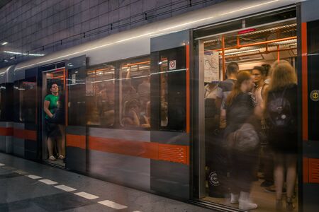 Prague, Czech Republic,23 July 2019; People at metro station entering subway train, long exposure technique for movement. Urban scene, city life, public transport and traffic concept.のeditorial素材