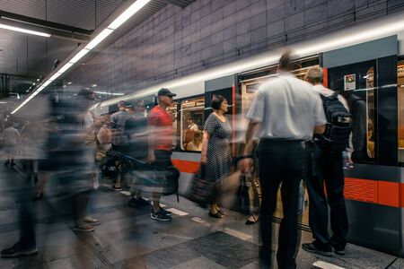 Prague, Czech Republic,23 July 2019; People at metro station entering subway train, long exposure technique for movement. Urban scene, city life, public transport and traffic concept.のeditorial素材