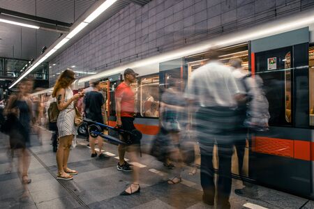 Prague, Czech Republic,23 July 2019; People at metro station entering subway train, long exposure technique for movement. Urban scene, city life, public transport and traffic concept.のeditorial素材