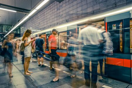 Prague, Czech Republic,23 July 2019; People at metro station entering subway train, long exposure technique for movement. Urban scene, city life, public transport and traffic concept.のeditorial素材