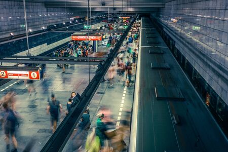Prague, Czech Republic,23 July 2019; People at metro station entering subway train or walking by, long exposure technique for movement. Urban scene, city life, public transport and traffic concept.のeditorial素材