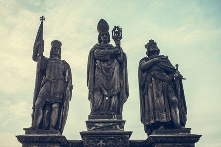 Statues of Saints Norbert, Wenceslaus and Sigismund on Charles Bridge in Prague, Czech Republic. Medieval Gothic bridge, finished in the 15th century, crossing the Vltava Riverの写真素材