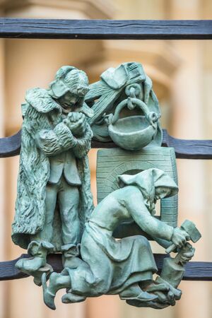 Decorations figure on the gothic gate fence at St. Vitus Cathedral in Pragueの写真素材