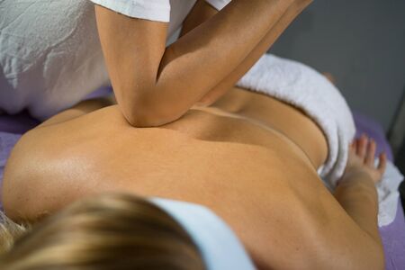 Female relaxing back massage with hands. Beauty body skin care treatment concept.