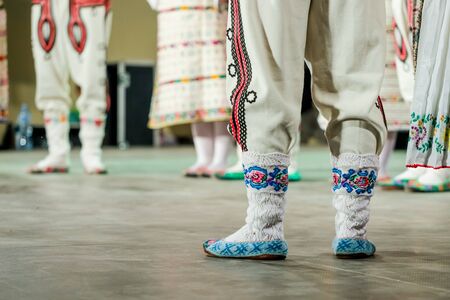 Close up of wool socks on legs of young Romanian dancer in traditional folkloric costume. Folklore of Romaniaの写真素材