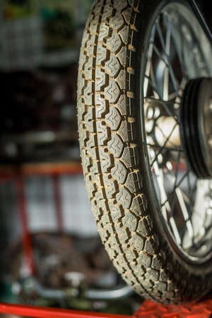 Pancevo, Serbia - September 27, 2019: Tire of Old timer motorcycle parked in collectors museum.のeditorial素材