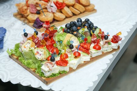 Decorated food on table prepared for wedding guestsの写真素材
