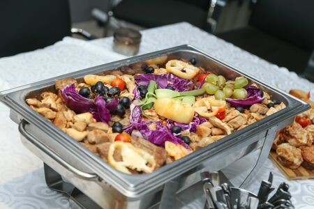 Decorated food on table prepared for wedding guestsの写真素材