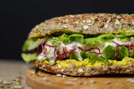 Close up of juicy healthy vegetarian tortilla on wooden plate