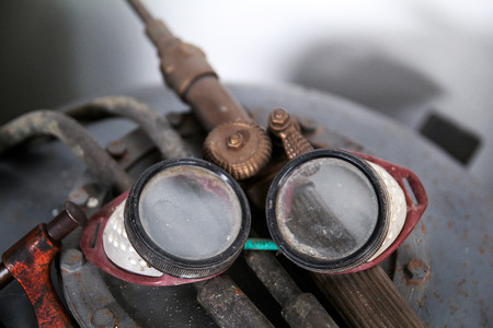Old protective goggles for welding and grindingの写真素材