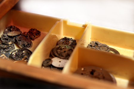 Old clocks and parts clockworks in drawers