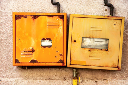 Protective metal box of gas meter on the wall of the houseの写真素材