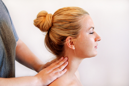 Massage relax professional studio. Spa treatment. Man relaxing comfort getting neck and shoulder massage. Masseuse human hands massaging for neck. Man getting making neck massage at spa. Body care.の写真素材
