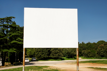 Street blank advertising billboard display, announcement table. Advertising agencies. Billboard with copy space for your text message or content, outdoor advertising mock up, public information board.の写真素材