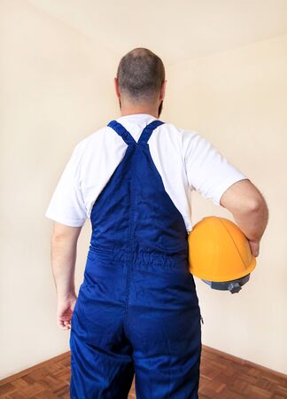 Construction worker and handyman is working on renovation of apartment.の写真素材