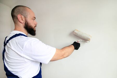 Construction worker doing finish renovation at apartment.の写真素材